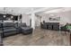 Open living and dining area with wood-look tile floors at 19826 W Lincoln St, Buckeye, AZ 85326