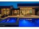 Stunning backyard at night with a pool and spa at 37200 N Cave Creek Rd # 1005, Scottsdale, AZ 85262