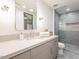 Contemporary bathroom featuring a walk-in shower and sleek vanity at 37200 N Cave Creek Rd # 1005, Scottsdale, AZ 85262