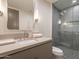 Modern bathroom with a glass shower, floating vanity, and updated fixtures at 37200 N Cave Creek Rd # 1005, Scottsdale, AZ 85262
