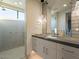 Spa-like bathroom with a large walk-in shower and modern vanity at 37200 N Cave Creek Rd # 1005, Scottsdale, AZ 85262