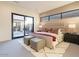 Spacious bedroom with sliding glass doors leading to a private patio at 37200 N Cave Creek Rd # 1005, Scottsdale, AZ 85262
