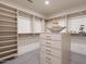 Large walk-in closet with custom shelving and drawers at 37200 N Cave Creek Rd # 1005, Scottsdale, AZ 85262