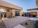Private courtyard with water feature, potted plants, and access to multiple rooms at 37200 N Cave Creek Rd # 1005, Scottsdale, AZ 85262