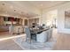 Spacious dining area with a long wooden table, comfortable seating, and a stylish rug at 37200 N Cave Creek Rd # 1005, Scottsdale, AZ 85262