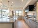 Modern kitchen with stainless steel appliances, custom cabinetry and an eat-in island at 37200 N Cave Creek Rd # 1005, Scottsdale, AZ 85262