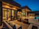 Modern patio furniture with a view into the home at 37200 N Cave Creek Rd # 1005, Scottsdale, AZ 85262