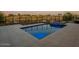 Inviting rectangular pool with blue lighting and a stone patio at 37200 N Cave Creek Rd # 1005, Scottsdale, AZ 85262