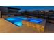 Modern pool and spa with blue lighting at night at 37200 N Cave Creek Rd # 1005, Scottsdale, AZ 85262