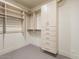 Large walk-in closet with ample shelving and drawer space at 37200 N Cave Creek Rd # 1005, Scottsdale, AZ 85262