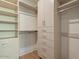 Spacious walk-in closet with ample shelving and drawers at 37200 N Cave Creek Rd # 1005, Scottsdale, AZ 85262