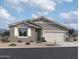 New single-story house with a two-car garage and desert landscaping at 24232 W Bowker St, Buckeye, AZ 85326