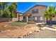 Two story house, landscaped backyard, and a bench at 7216 W Irma Ln, Glendale, AZ 85308