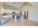 Kitchen with stainless steel appliances, island, and white cabinets at 7216 W Irma Ln, Glendale, AZ 85308