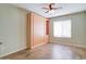 Bedroom with built-in wooden wall unit including a Murphy bed and shelving at 7216 W Irma Ln, Glendale, AZ 85308