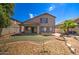 Two-story house with a covered patio and landscaped backyard at 7216 W Irma Ln, Glendale, AZ 85308