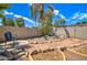 Landscaped backyard with seating area and fire pit at 7216 W Irma Ln, Glendale, AZ 85308