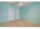Light and airy bedroom with neutral carpeting and two closets at 7216 W Irma Ln, Glendale, AZ 85308