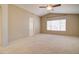 Spacious bedroom with neutral wall colors and carpet flooring at 7216 W Irma Ln, Glendale, AZ 85308