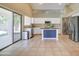 Bright kitchen with island, stainless steel appliances, and white cabinets at 7216 W Irma Ln, Glendale, AZ 85308
