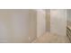 Hallway with neutral colored walls, carpet, and closets at 7216 W Irma Ln, Glendale, AZ 85308
