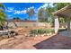 Landscaped backyard with artificial turf and brick patio at 7216 W Irma Ln, Glendale, AZ 85308