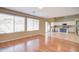 Bright living room with hardwood floors and kitchen access at 7216 W Irma Ln, Glendale, AZ 85308