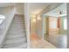 Carpeted staircase with white railing leading to the upper level of the home at 7216 W Irma Ln, Glendale, AZ 85308