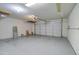 Garage with overhead storage and a large mirror at 7216 W Irma Ln, Glendale, AZ 85308