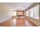 Spacious living room with hardwood floors and built-in shelving at 7216 W Irma Ln, Glendale, AZ 85308