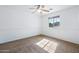 Spacious bedroom featuring a ceiling fan and large window at 31777 N Sundown Dr, San Tan Valley, AZ 85143