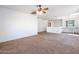 Open living area with neutral wall colors and ceiling fan at 31777 N Sundown Dr, San Tan Valley, AZ 85143