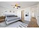Main bedroom with a king-size bed and access to the bathroom at 31777 N Sundown Dr, San Tan Valley, AZ 85143