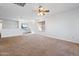 Bright living room featuring carpeted floors and ceiling fan at 31777 N Sundown Dr, San Tan Valley, AZ 85143