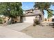 Two-story house with a two car garage and landscaped front yard at 31777 N Sundown Dr, San Tan Valley, AZ 85143