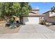 Two-story house with a two car garage and landscaped front yard at 31777 N Sundown Dr, San Tan Valley, AZ 85143