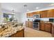 Kitchen with stainless steel appliances and granite countertops at 31777 N Sundown Dr, San Tan Valley, AZ 85143