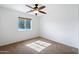 Bright bedroom with ceiling fan and carpet flooring at 31777 N Sundown Dr, San Tan Valley, AZ 85143