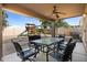 Patio overlooks backyard with playset and grassy area at 31777 N Sundown Dr, San Tan Valley, AZ 85143