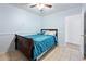 Spacious bedroom with ceiling fan and large window at 31777 N Sundown Dr, San Tan Valley, AZ 85143