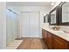 Double vanity bathroom with tiled floors and large mirrors at 31777 N Sundown Dr, San Tan Valley, AZ 85143