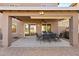 Covered patio features a dining area and built-in grill at 31777 N Sundown Dr, San Tan Valley, AZ 85143