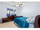 Bedroom with dark wood furniture and teal bedding at 31777 N Sundown Dr, San Tan Valley, AZ 85143