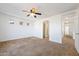 Large main bedroom with carpeted floors and ceiling fan at 31777 N Sundown Dr, San Tan Valley, AZ 85143