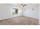 Bright bedroom with carpeted floors and ceiling fan at 31777 N Sundown Dr, San Tan Valley, AZ 85143