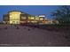 Community center with lighted exterior and gated area at dusk at 2851 N Coronado Dr, Florence, AZ 85132