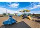 Community playground with playset and shaded area at 11813 W Marguerite Ave, Avondale, AZ 85323