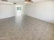 Spacious living room with tile flooring and access to patio at 4847 W Granada Rd, Phoenix, AZ 85035