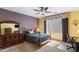 Bright bedroom with a double bed and dresser at 42609 W Milky Way, Maricopa, AZ 85138