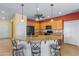 Kitchen with a large island and granite countertops at 42609 W Milky Way, Maricopa, AZ 85138
